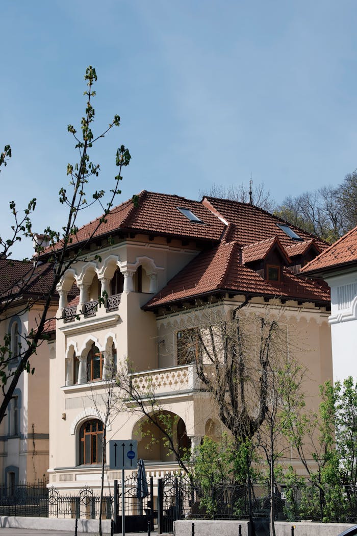 Elegant historical house with intricate architecture in Brașov, Romania, captured on a sunny day.